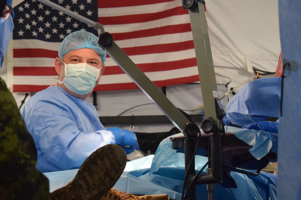 U.S. Air Force medical personnel working in surgical attire during the Vigorous Warrior 19 Romania surgical exchange